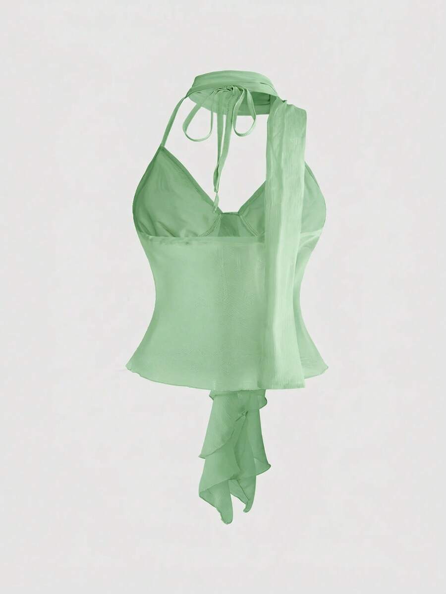 Black halter crop top featuring an asymmetrical ruffle hem and backless design for women.
