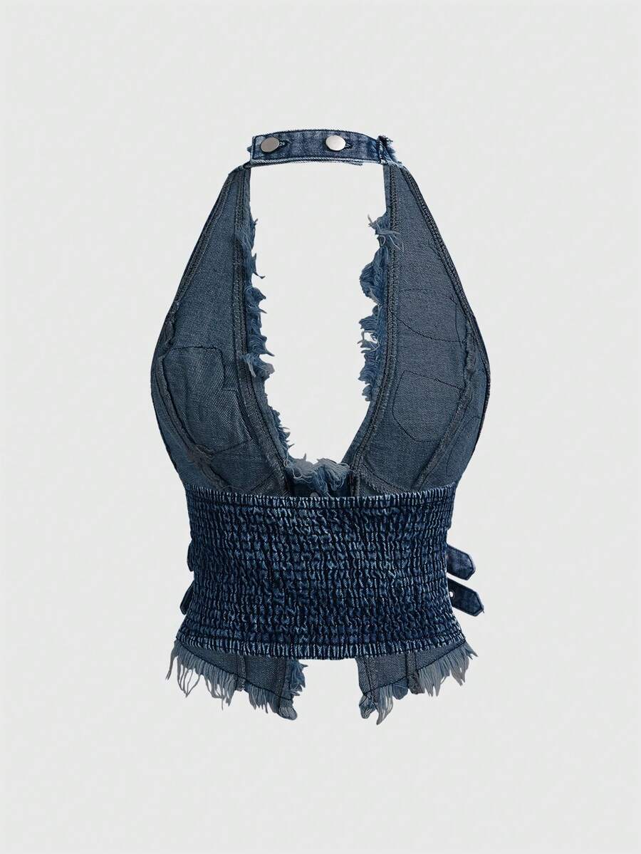 Women's denim halter crop top featuring a backless design, asymmetrical hem, single-breasted front, and lettuce trim.