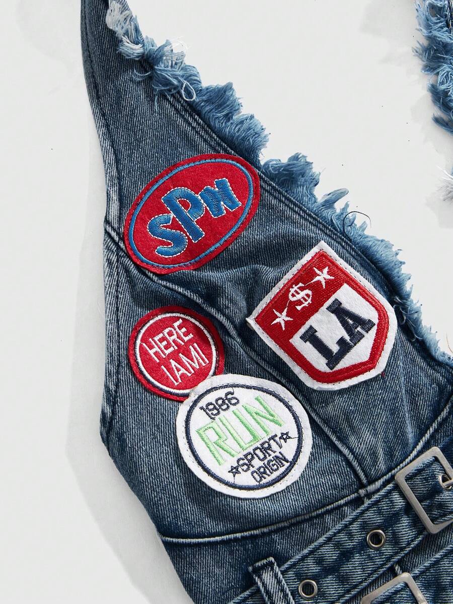 Women's denim halter crop top featuring a backless design, asymmetrical hem, single-breasted front, and lettuce trim.