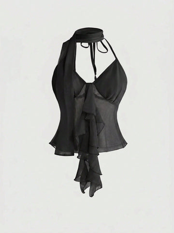 Black halter crop top featuring an asymmetrical ruffle hem and backless design for women.