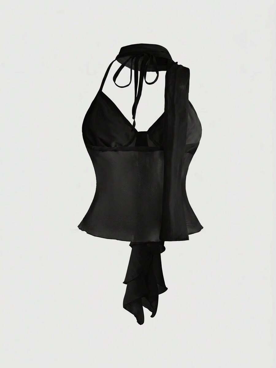 Black halter crop top featuring an asymmetrical ruffle hem and backless design for women.