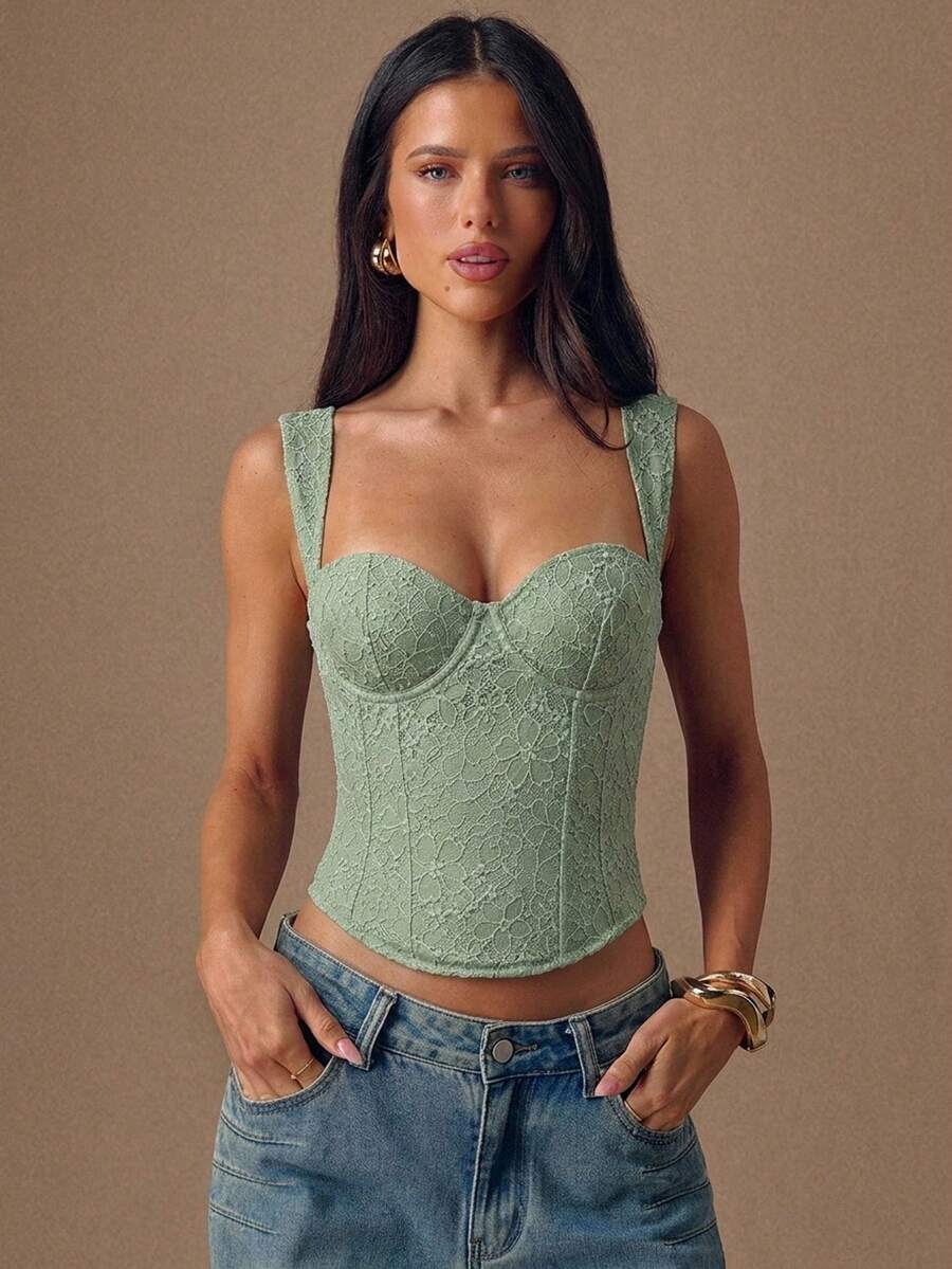 Women's slim fit tank top with rhinestone detail, wide straps, and a short length for casual beach wear.
