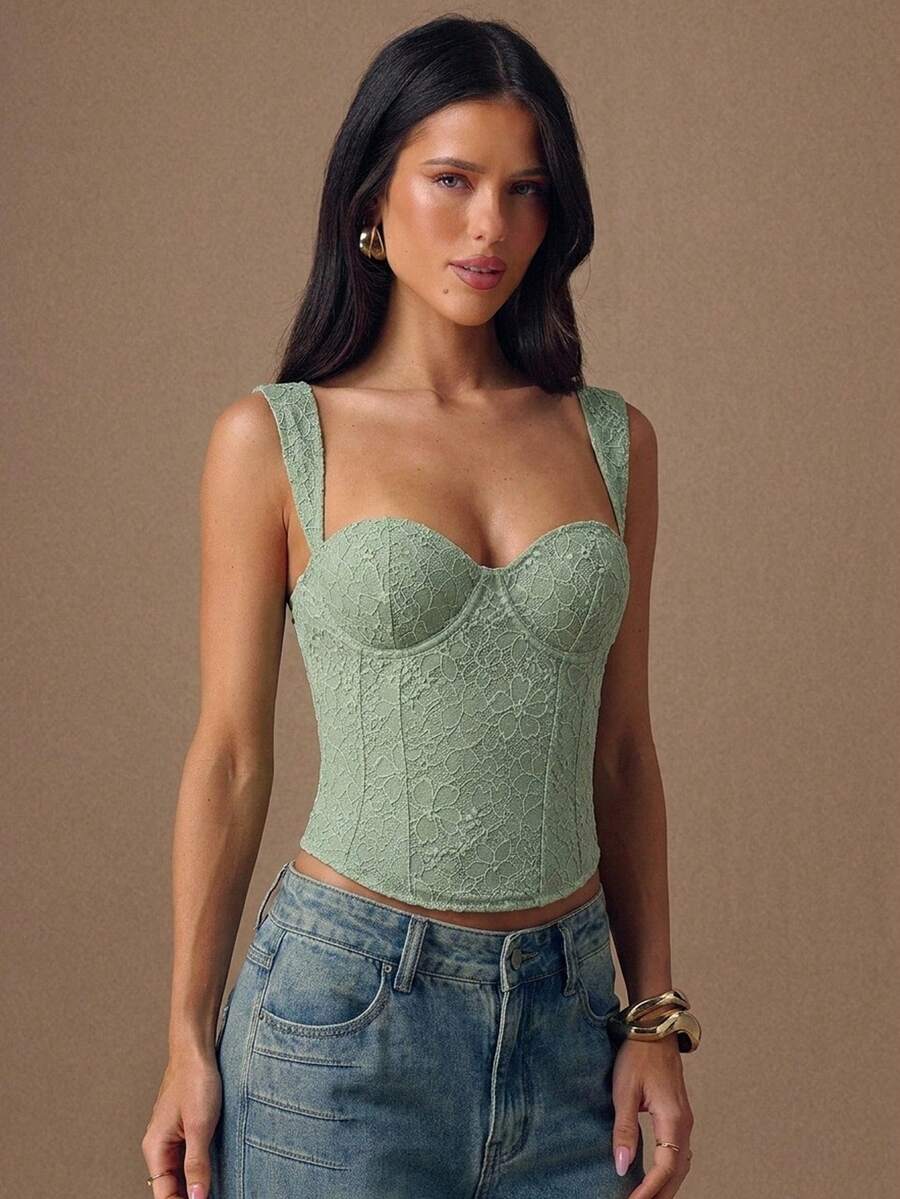 Women's slim fit tank top with rhinestone detail, wide straps, and a short length for casual beach wear.