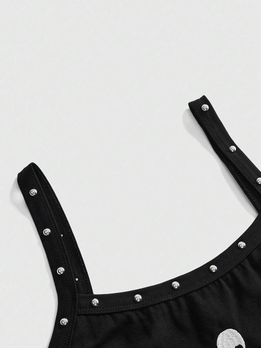 Women's black slim fit cami tank top featuring rhinestone skull accents, shoulder straps, and high-stretch knitted fabric.