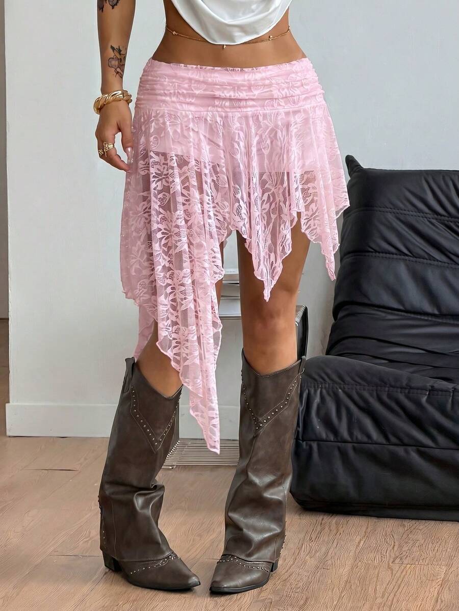 Women's asymmetrical ruffle skort with low waist, hollow out details, and lined body in knitted stretch fabric for beach and summer wear.