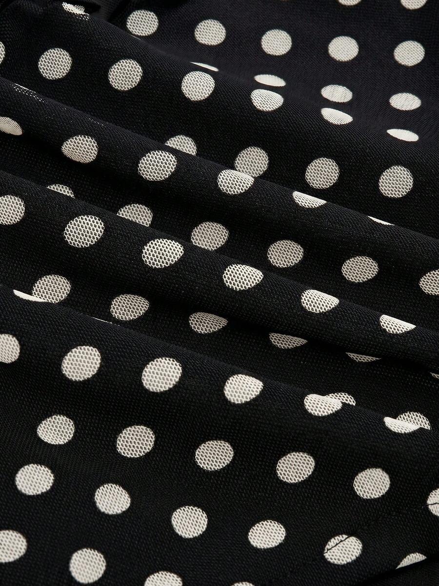 Women's black polka dot strapless tube top made of ruched mesh fabric featuring an asymmetrical hem and matching scarf.