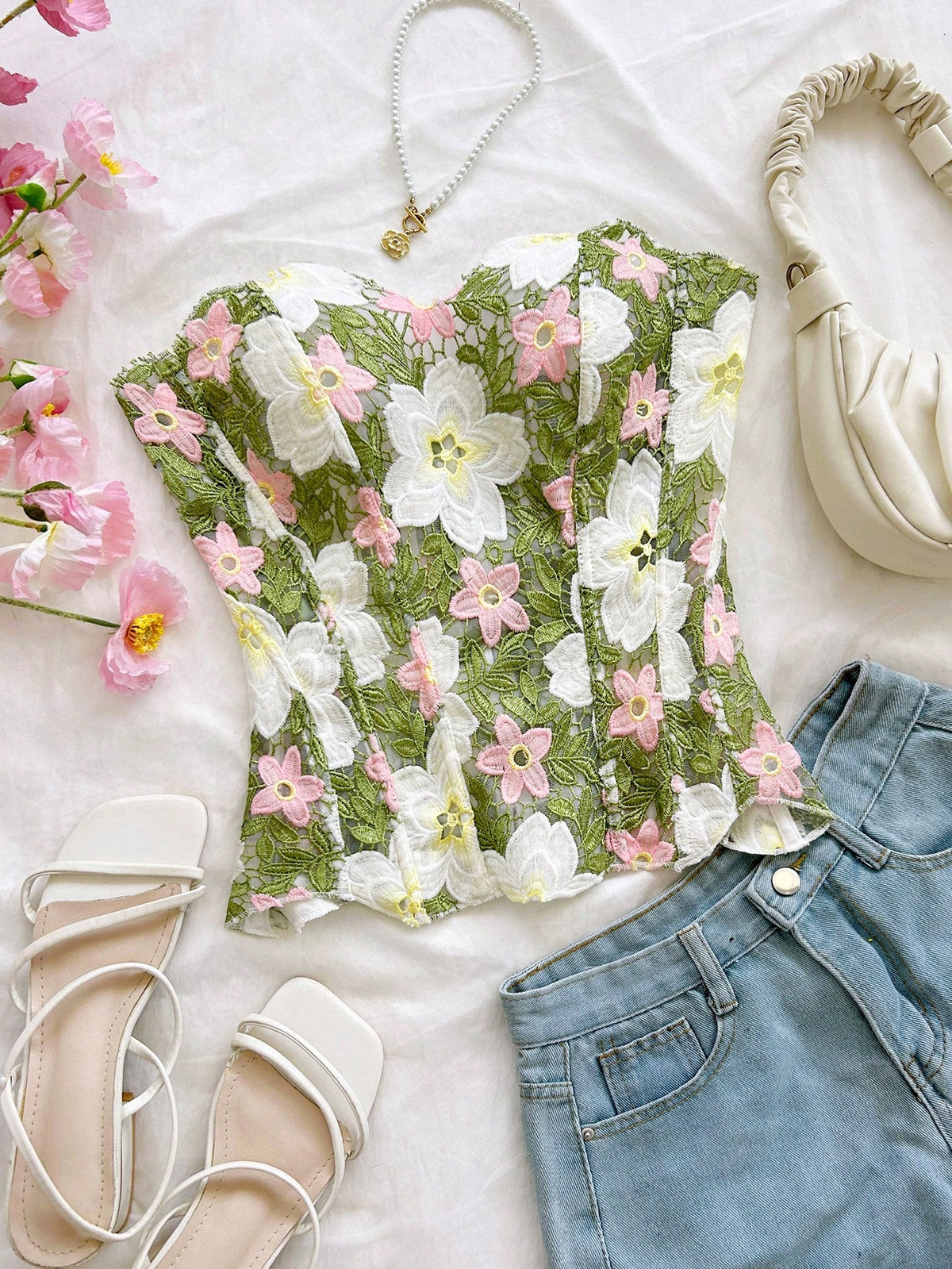 Strapless floral lace corset top with lace-up detail, asymmetrical hem, and slim fit for women.