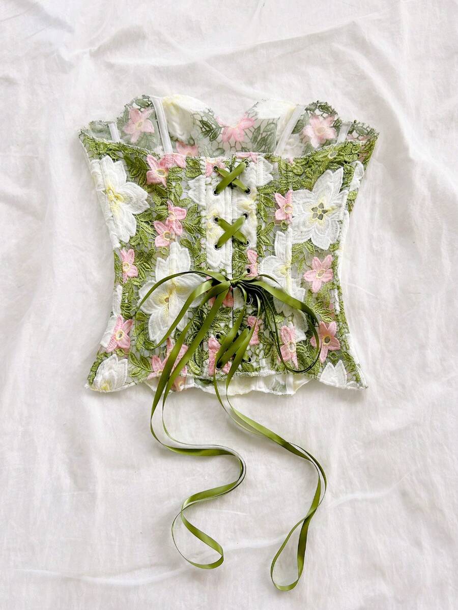 Strapless floral lace corset top with lace-up detail, asymmetrical hem, and slim fit for women.