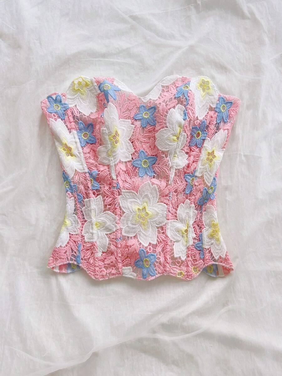 Strapless floral lace corset top with lace-up detail, asymmetrical hem, and slim fit for women.