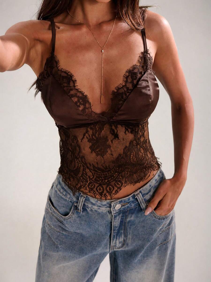 Women's black lace patchwork camisole top featuring spaghetti straps and backless design
