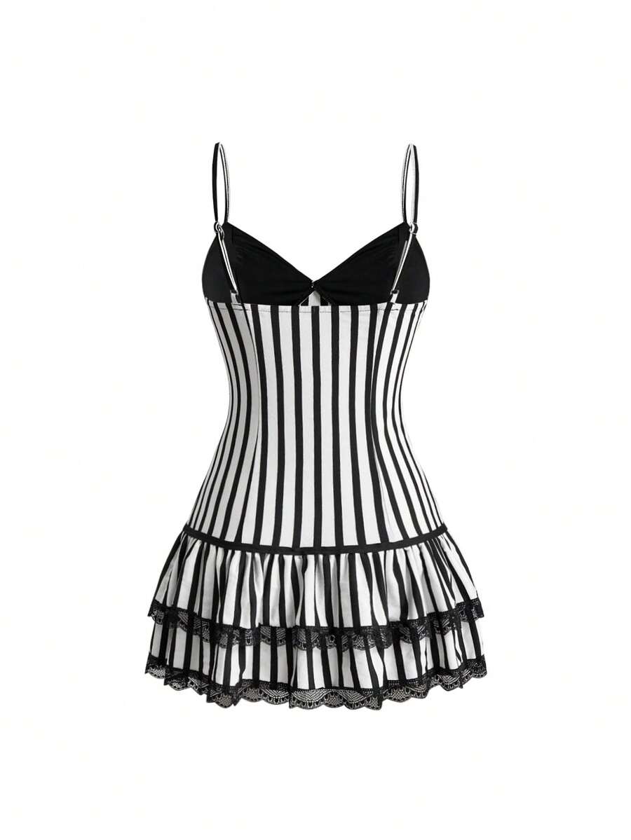 Women's black and white striped knit mini dress with spaghetti straps, slim fit silhouette, layered hem, and matching arm sleeves.