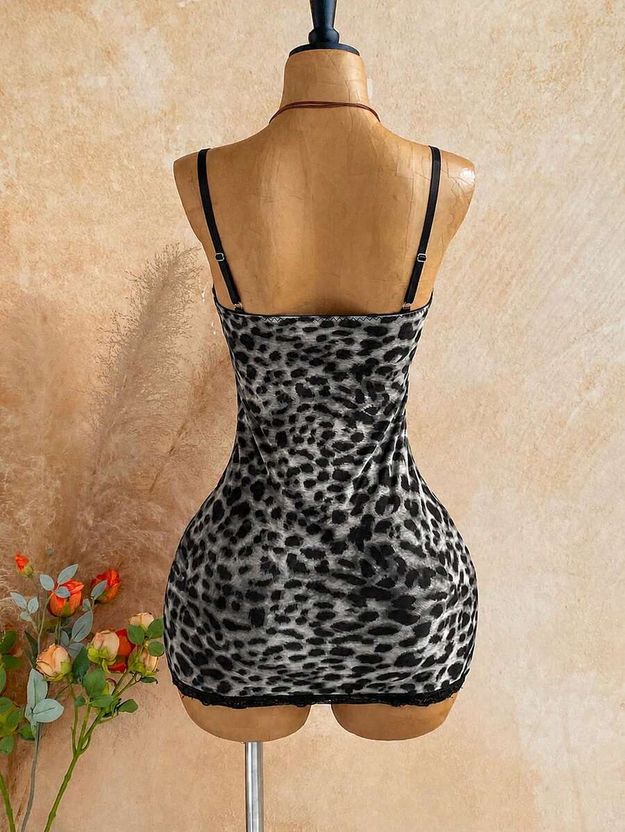 Women's black mesh bodycon mini dress featuring spaghetti straps, contrast lace cup details, backless styling, and a slim fit.