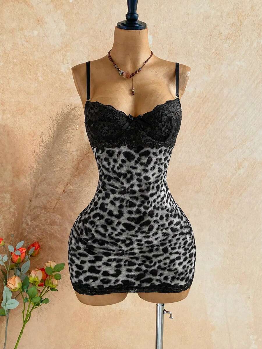 Women's black mesh bodycon mini dress featuring spaghetti straps, contrast lace cup details, backless styling, and a slim fit.