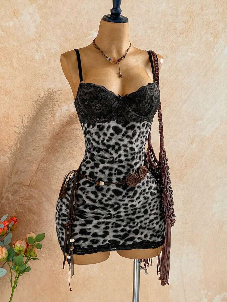 Women's black mesh bodycon mini dress featuring spaghetti straps, contrast lace cup details, backless styling, and a slim fit.
