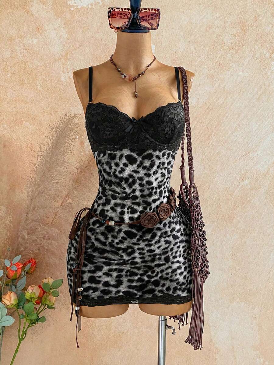 Women's black mesh bodycon mini dress featuring spaghetti straps, contrast lace cup details, backless styling, and a slim fit.