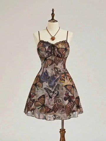 Women's brown boho cami mini dress featuring a graphic butterfly print, spaghetti straps, high waist flared hem, and matching arm sleeves in high-stretch mesh fabric.