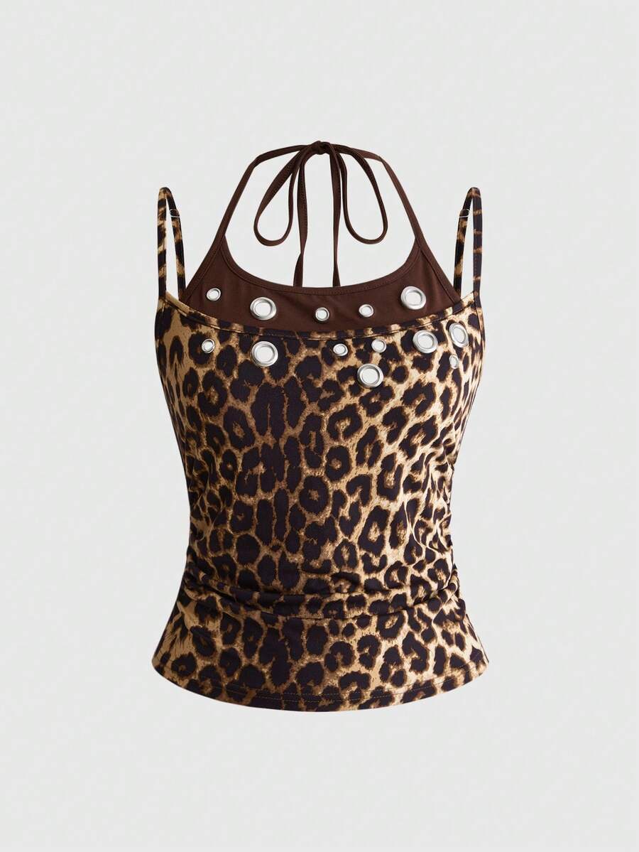 Black halter crop tank top for women featuring lace up front details, ruched accents, and appliques in a slim fit knitted fabric.