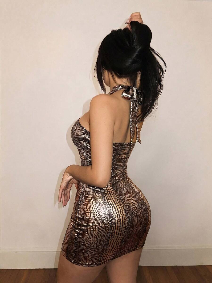 Women's black backless halter mini dress with tie-back details and a slim-fit bodycon silhouette.