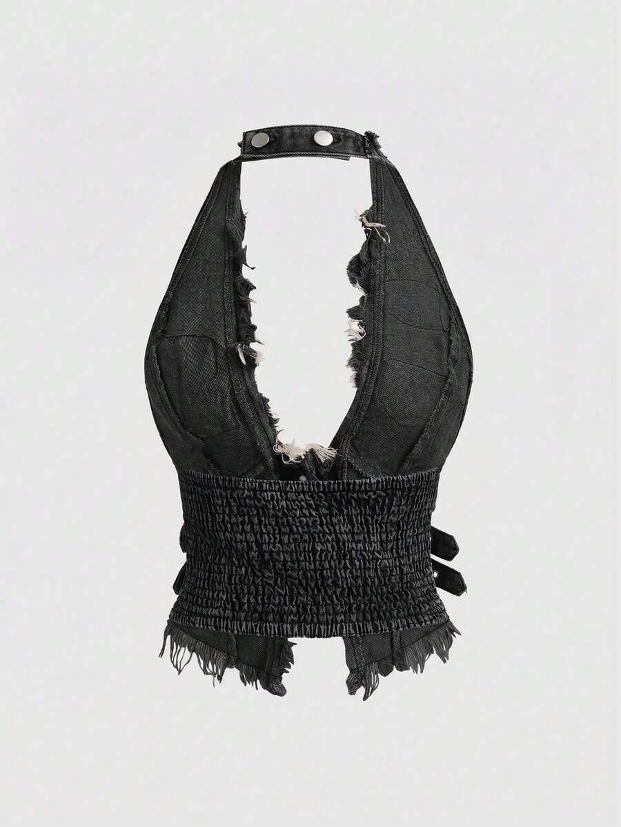 Women's denim halter crop top featuring a backless design, asymmetrical hem, single-breasted front, and lettuce trim.