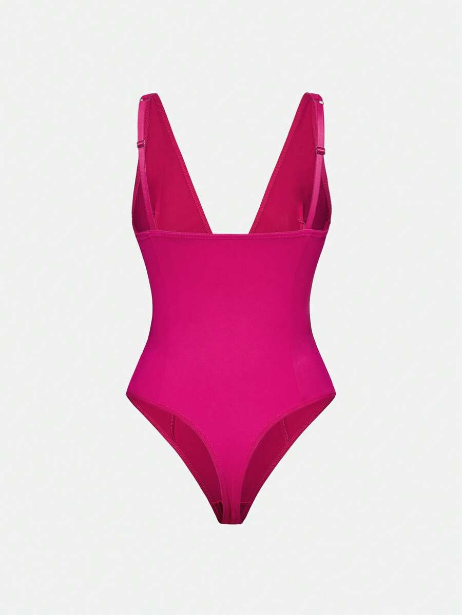 Apricot backless shapewear bodysuit with thong cut, cup details, and high-stretch fabric for light tummy support.