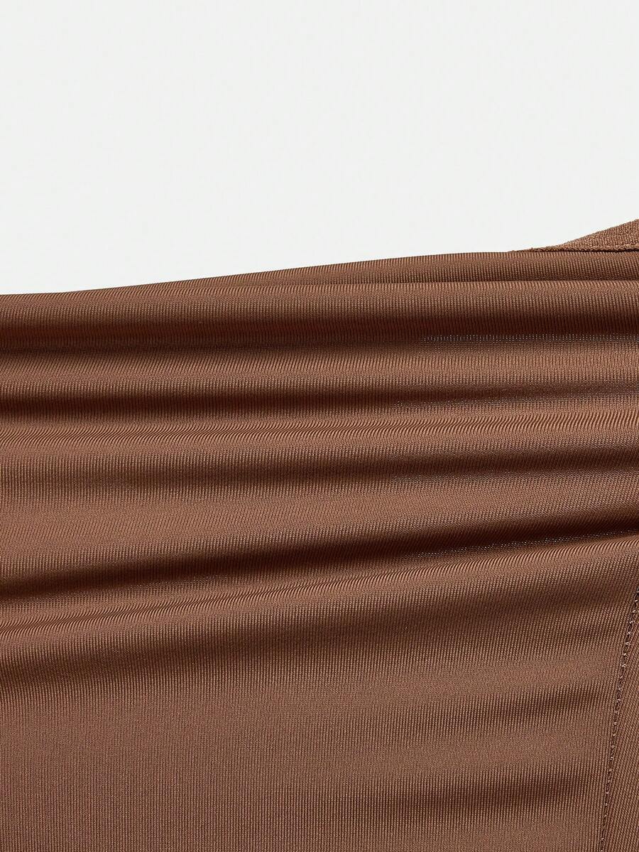 Apricot backless shapewear bodysuit with thong cut, cup details, and high-stretch fabric for light tummy support.
