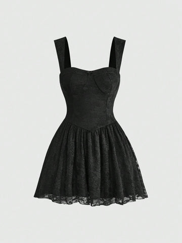 Front view of a women's black lace goth cami mini dress with shoulder straps, high waist flared hem, and matching lace arm sleeves.