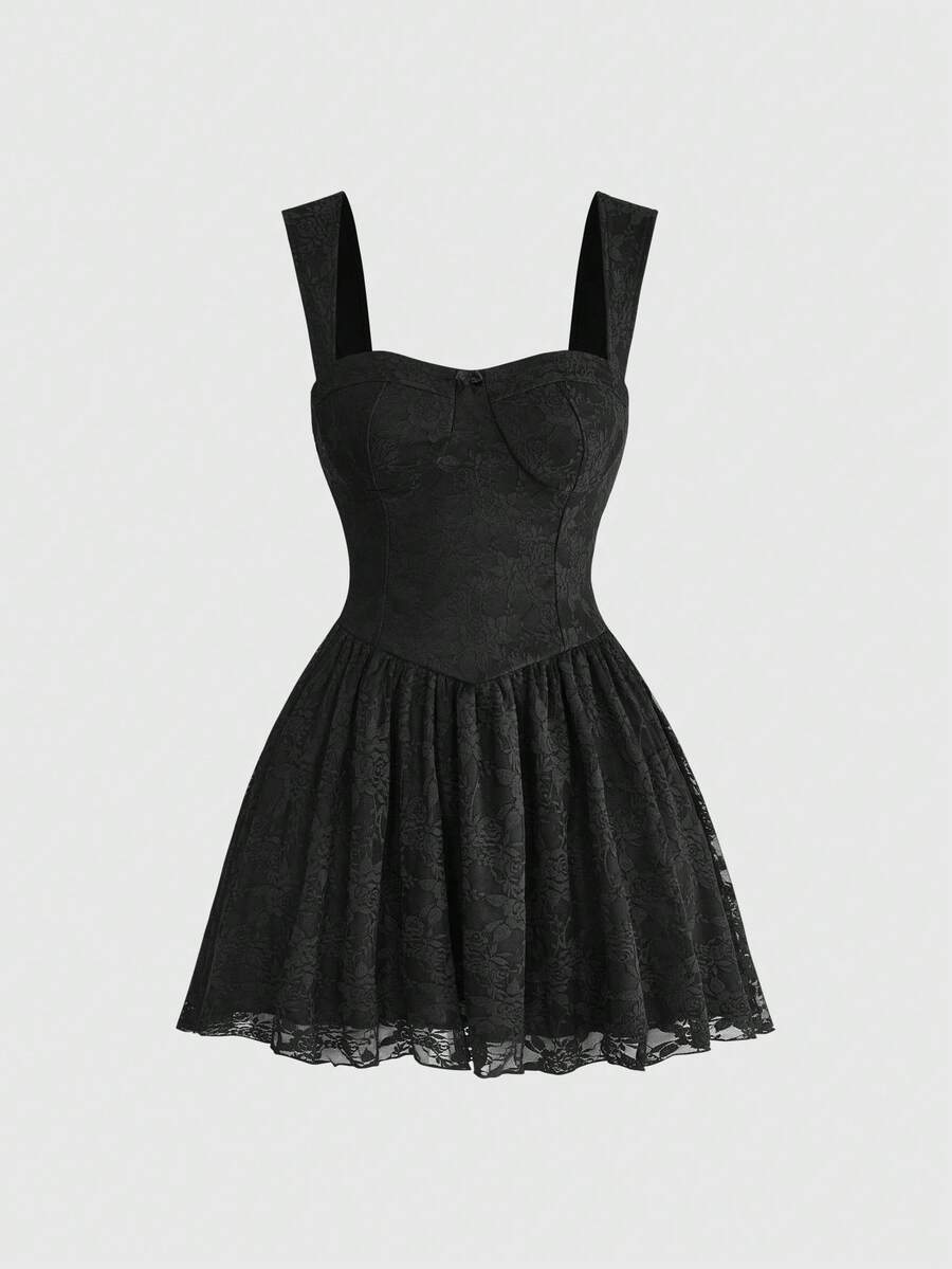 Front view of a women's black lace goth cami mini dress with shoulder straps, high waist flared hem, and matching lace arm sleeves.