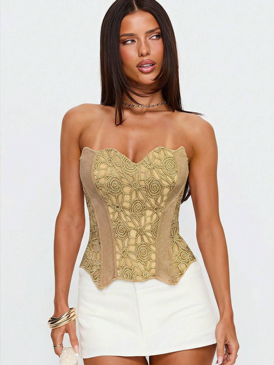 Strapless floral corset top with lace-up detail, asymmetrical hem, and slim fit for women in a boho vacation style.