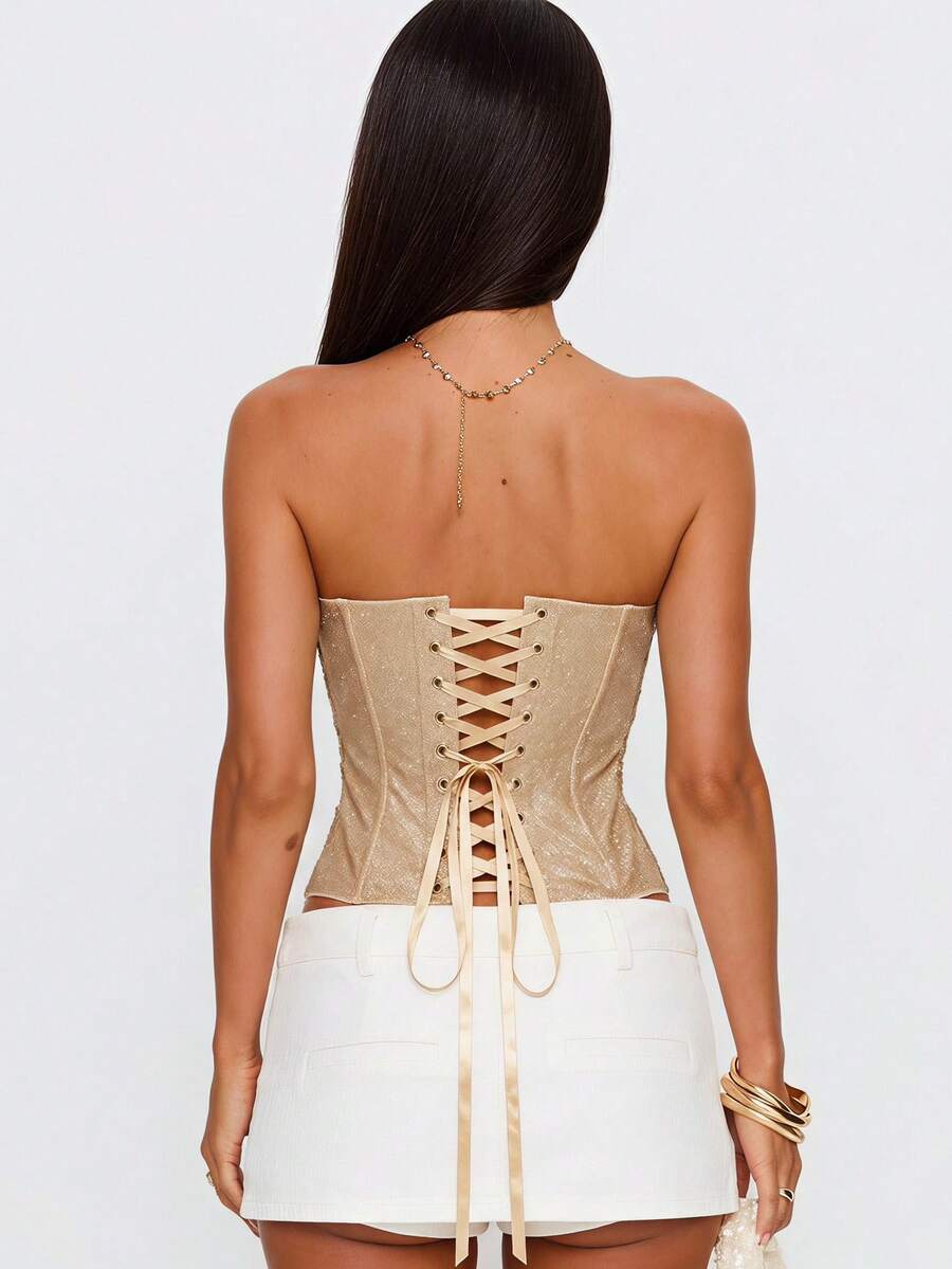 Strapless floral lace corset top with lace-up detail, asymmetrical hem, and slim fit for women.
