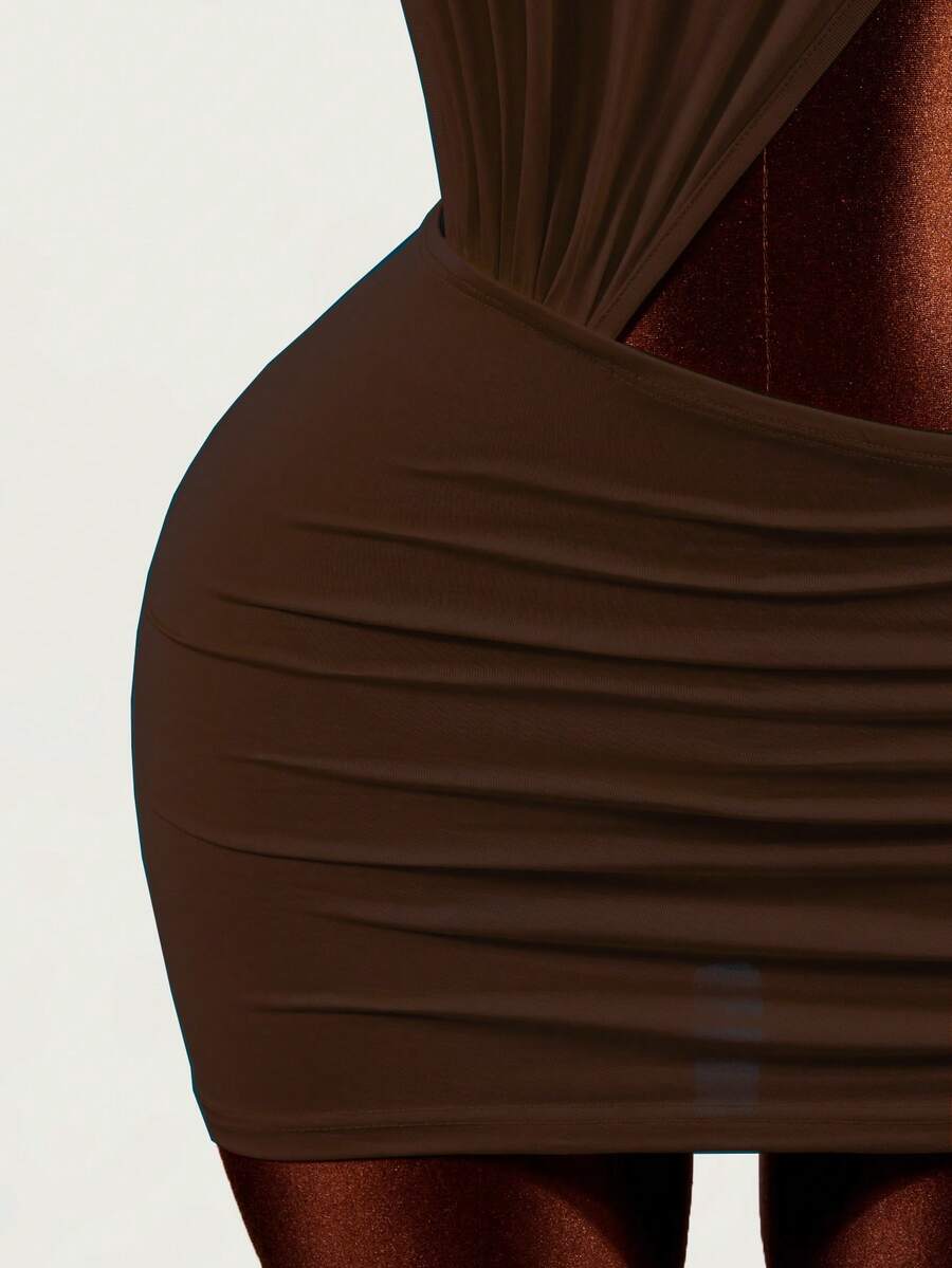 Women's black halter hollow out mini bodycon dress featuring backless asymmetrical knot details and a slim pencil fit.