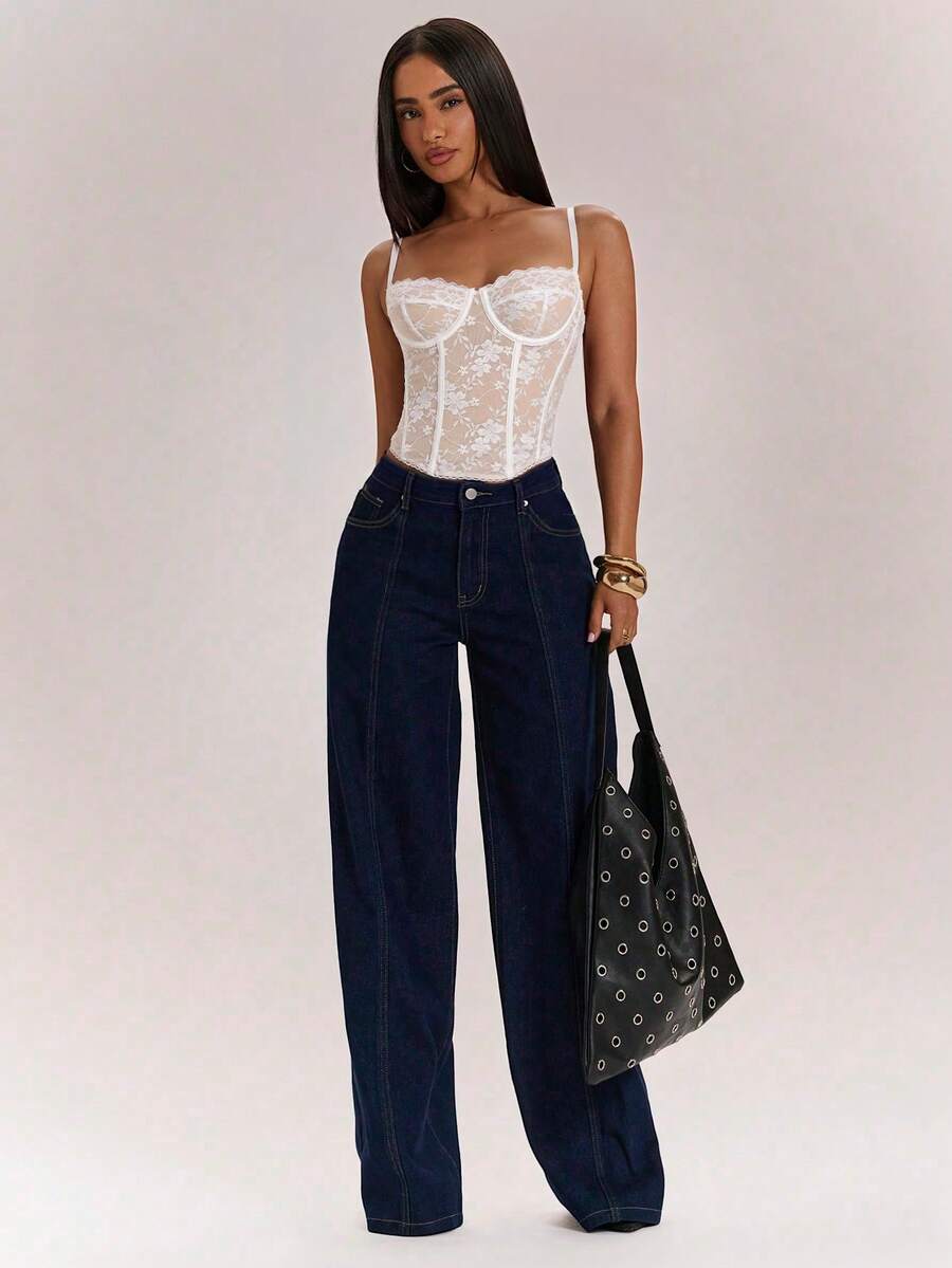 Women’s camisole top with cup detail, spaghetti straps, lined body, and slim fit design in knitted fabric with an asymmetrical hem.