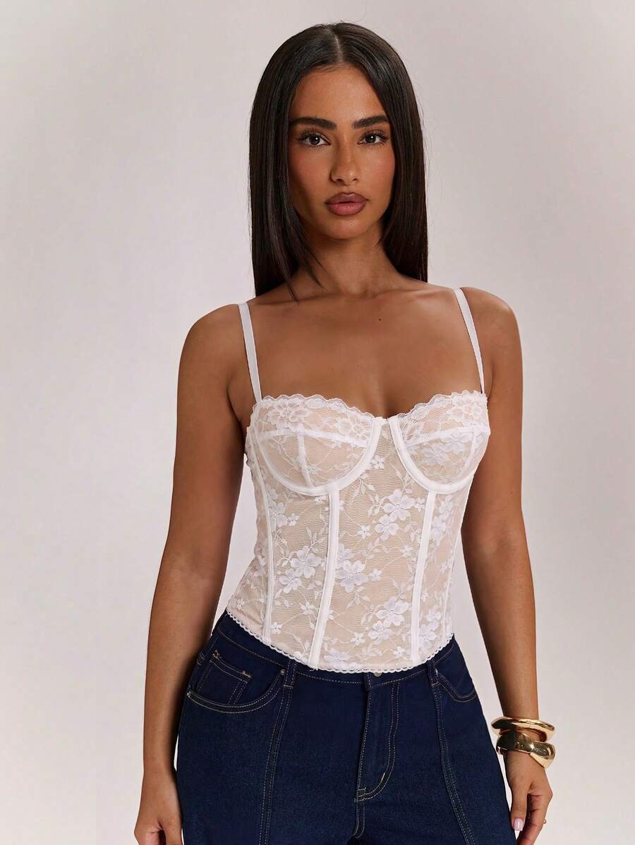 Women’s camisole top with cup detail, spaghetti straps, lined body, and slim fit design in knitted fabric with an asymmetrical hem.