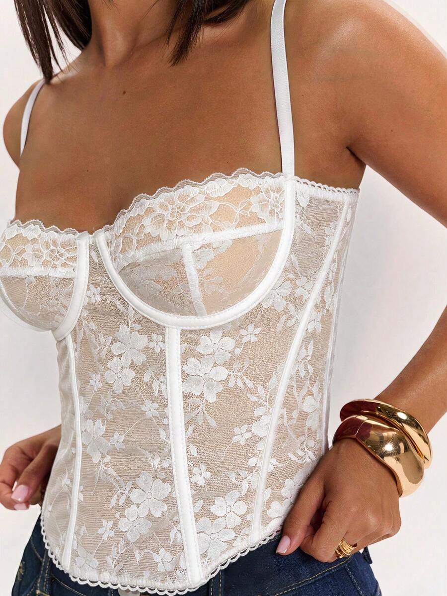 Women’s camisole top with cup detail, spaghetti straps, lined body, and slim fit design in knitted fabric with an asymmetrical hem.