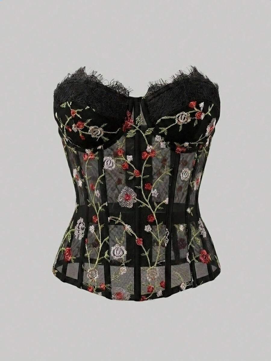 Women's black lace boned strapless bandeau crop top featuring semi-sheer baroque embroidered detail, slim fit silhouette, and asymmetrical hem.