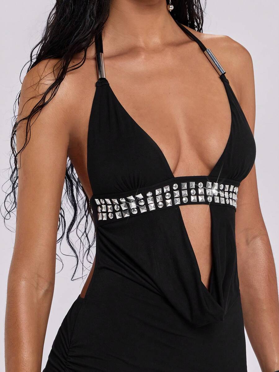 Sleeveless halter backless mini bodycon dress with high waist and tie-back detailing.