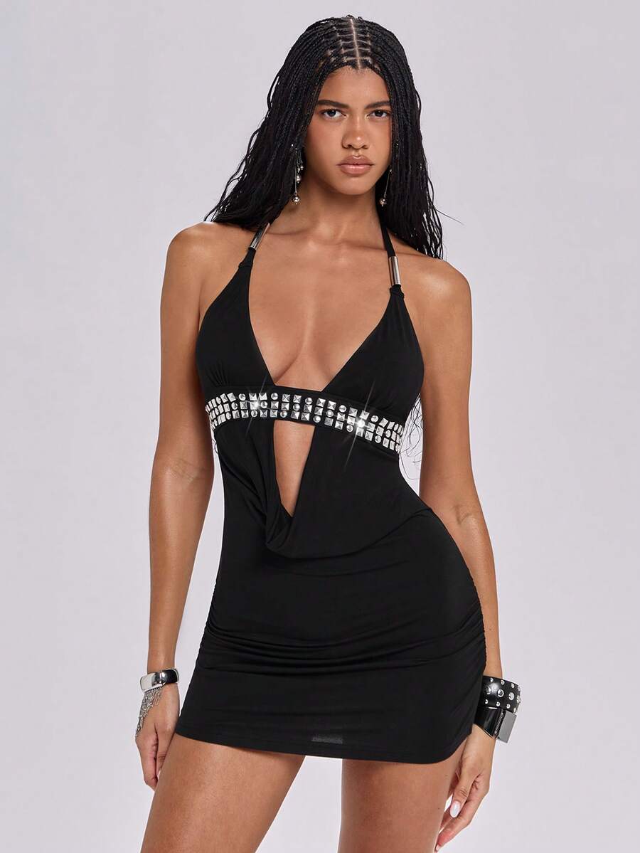 Sleeveless halter backless mini bodycon dress with high waist and tie-back detailing.