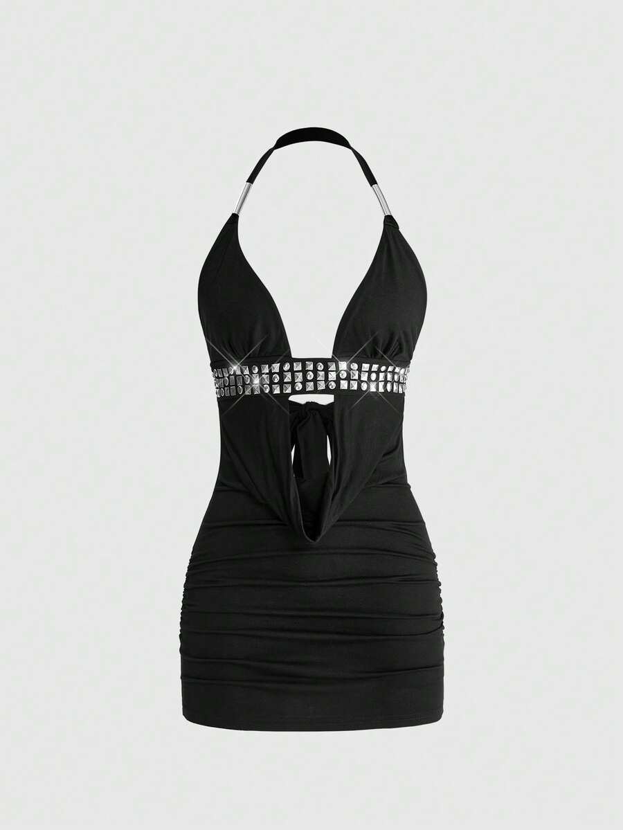Sleeveless halter backless mini bodycon dress with high waist and tie-back detailing.