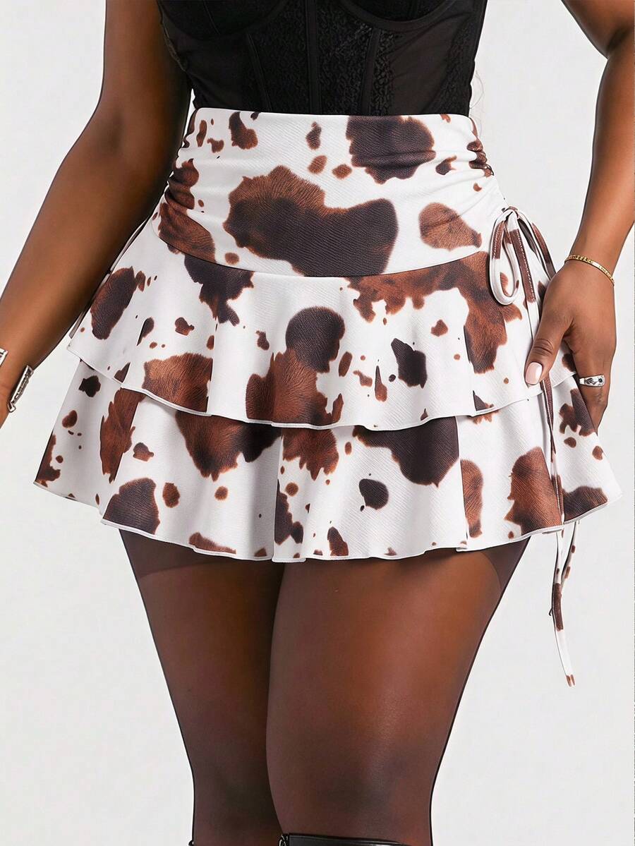 Women's black PU coated layered ruffle mini skirt featuring a high waist, tiered ruffle hem, and zipper detail.