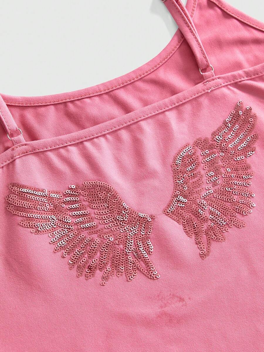 Women's pink cropped spaghetti strap tank top featuring a rhinestone wing design on the back in a slim fit knit style.
