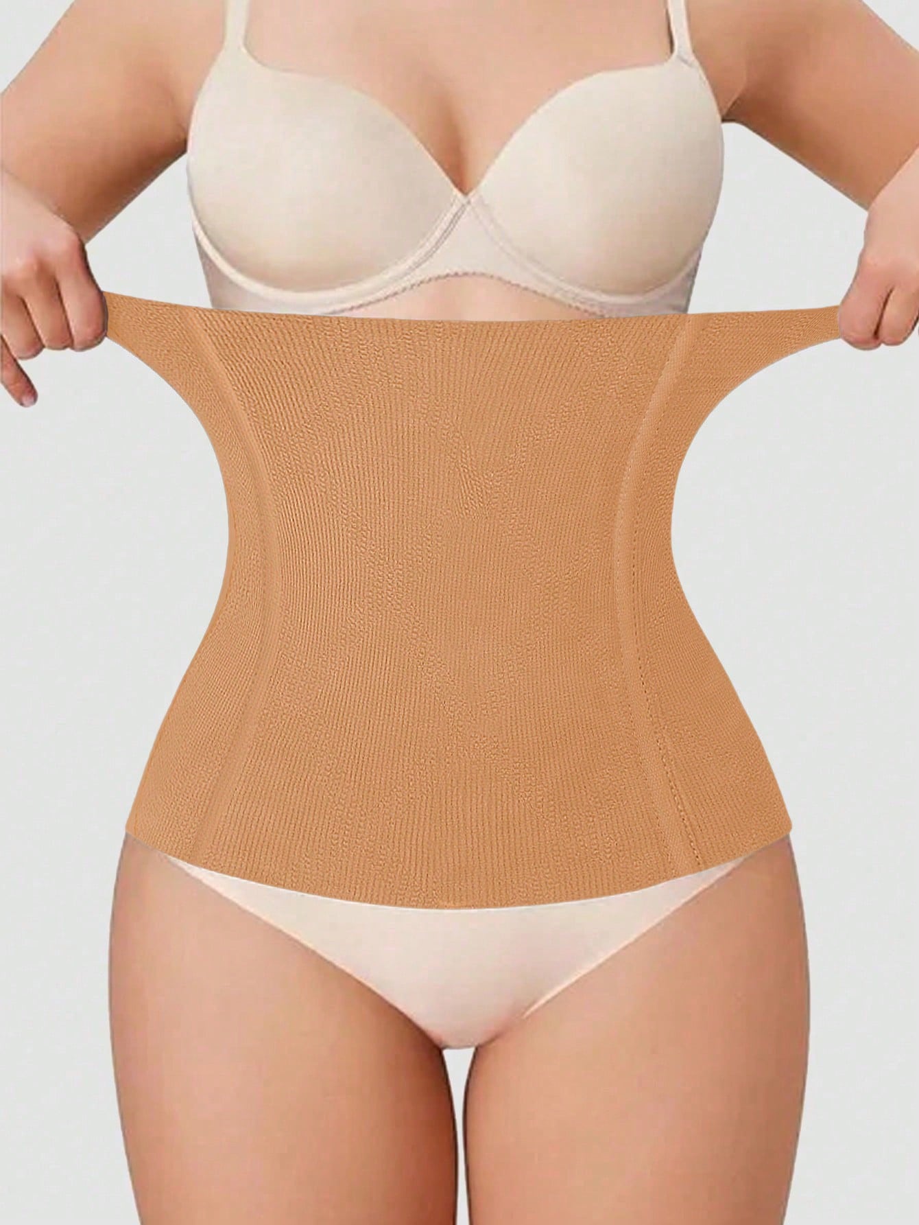 Black women's seamless waist cincher belt for waist support and daily wear.