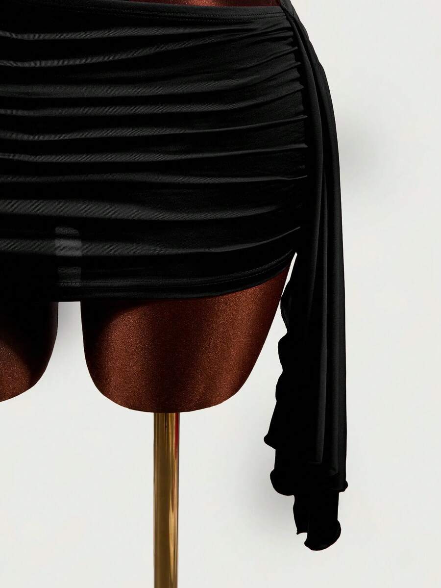 Women's black halter hollow out mini bodycon dress featuring backless asymmetrical knot details and a slim pencil fit.