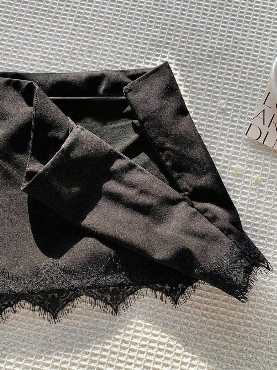 Women's low-waist black lace patchwork mini skirt with bodycon fit.