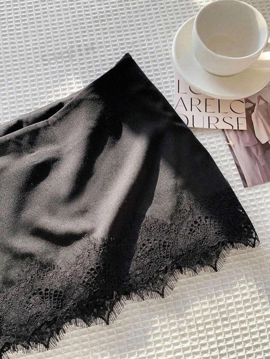 Women's low-waist black lace patchwork mini skirt with bodycon fit.
