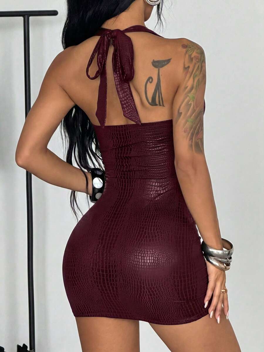 Women's black halter bodycon mini dress with studded rivet details in coated fabric