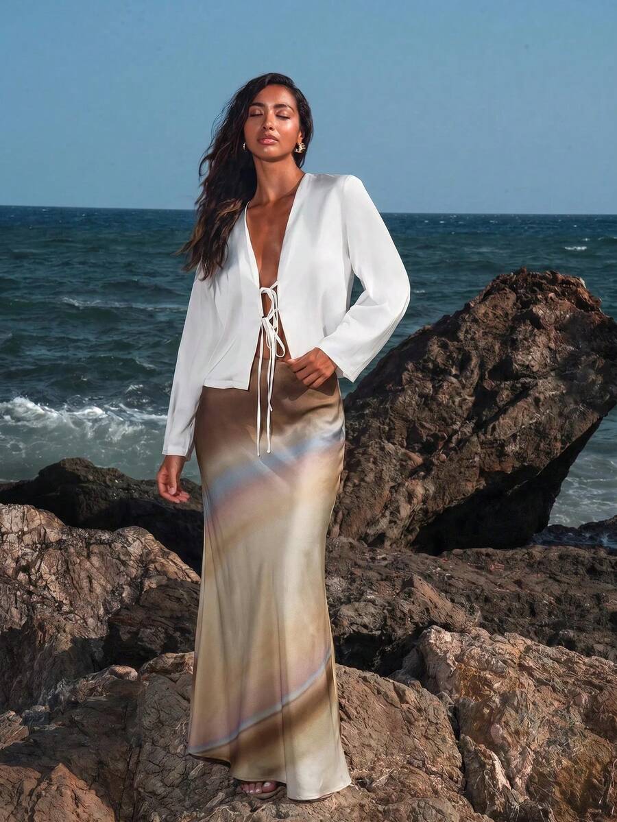 Women's black woven mermaid maxi skirt featuring a solid color design, mid waist, and 100% cotton fabric.
