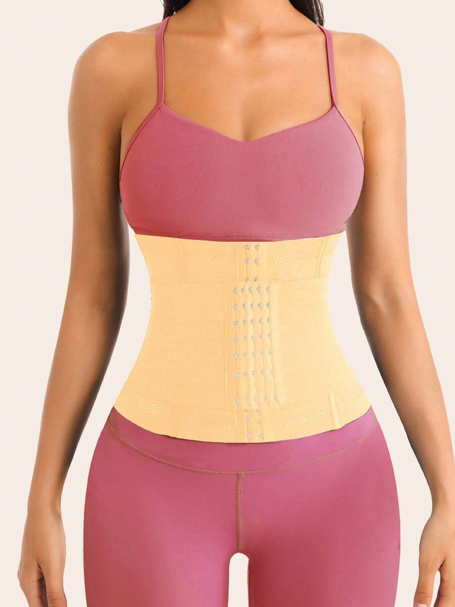 Black adjustable waist cincher shapewear for women made of high stretch knitted fabric for tummy and waist control.