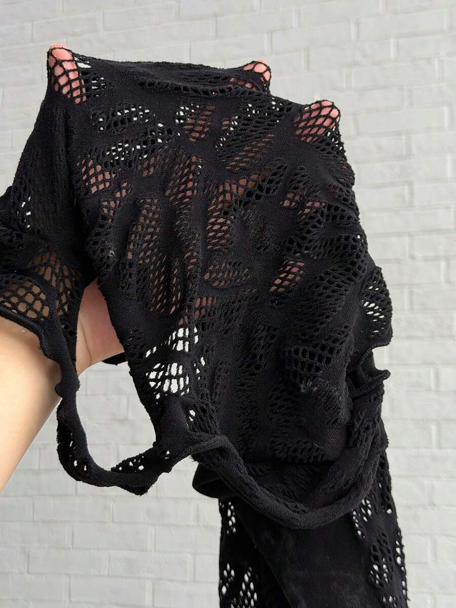 Women's black short sleeve bodycon mini dress featuring a stand collar, cut-out details, pencil hem, and high stretch knitted fabric.