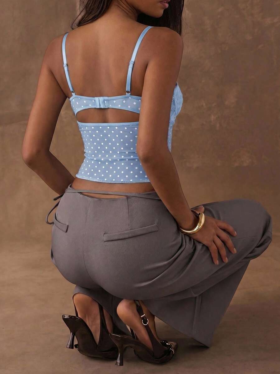 Women's black contrast lace camisole with spaghetti straps, cup detail, semi-sheer finish, and slim fit for going out or date night.