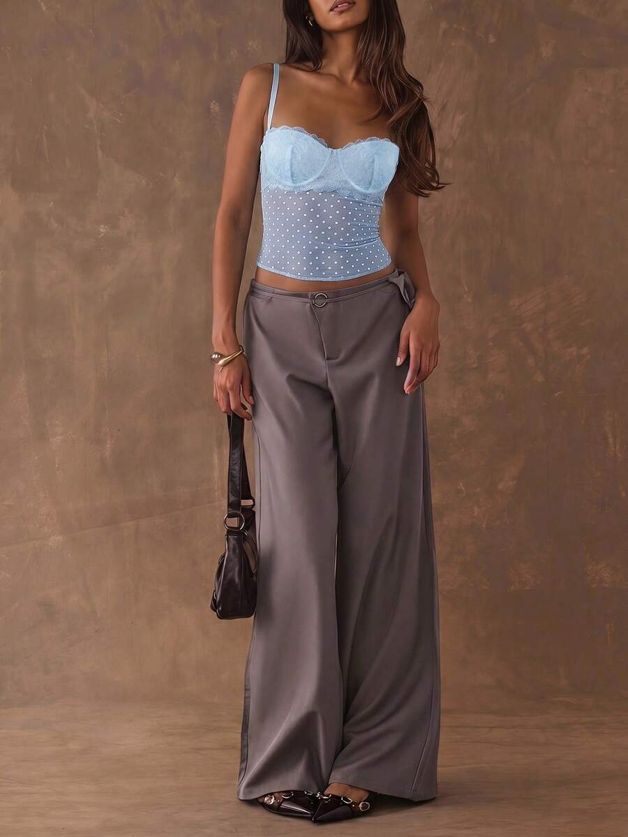 Women's black contrast lace camisole with spaghetti straps, cup detail, semi-sheer finish, and slim fit for going out or date night.
