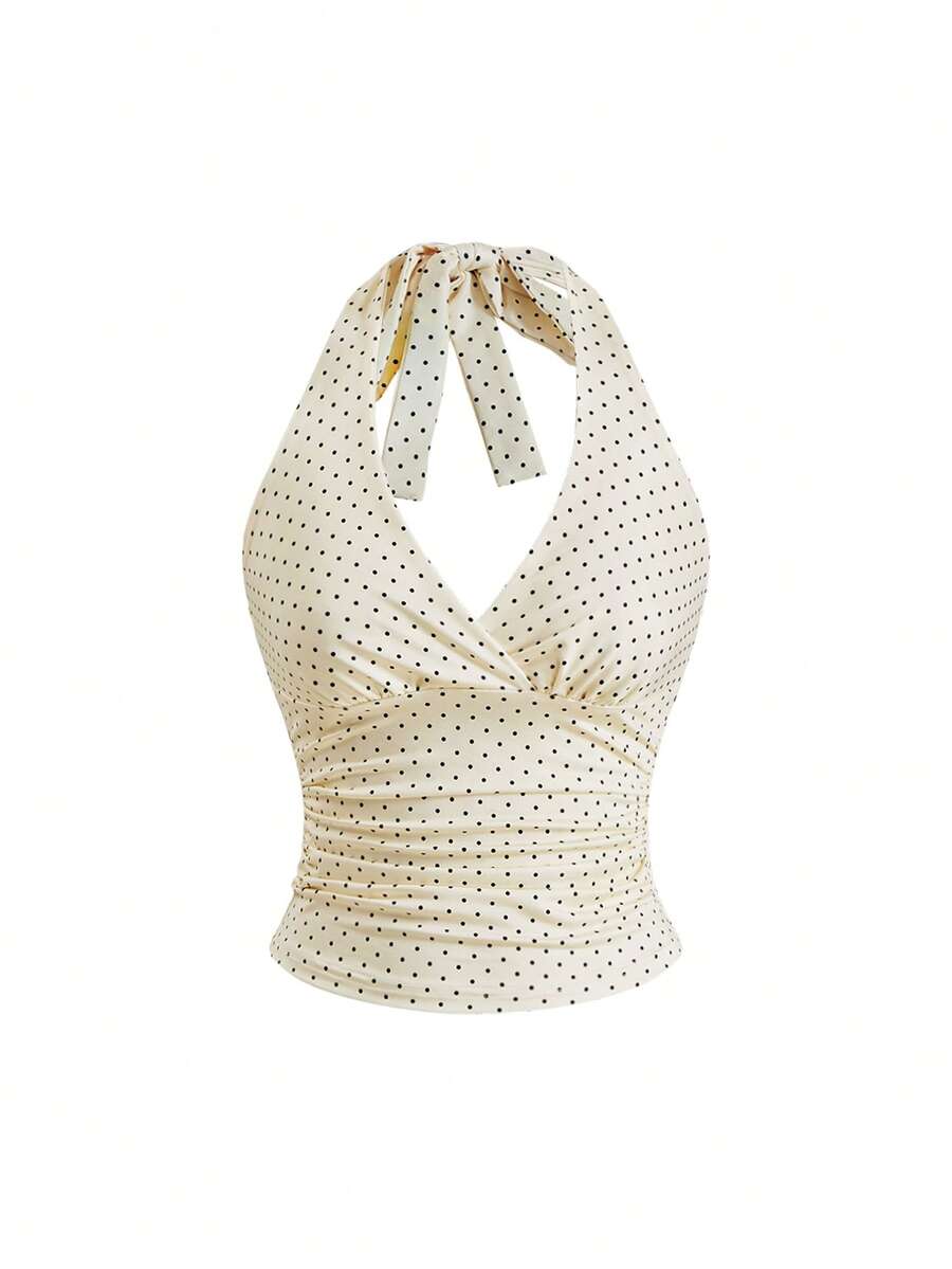 Women's halter crop tank top featuring a backless silhouette and ruched detailing in a slim fit design.